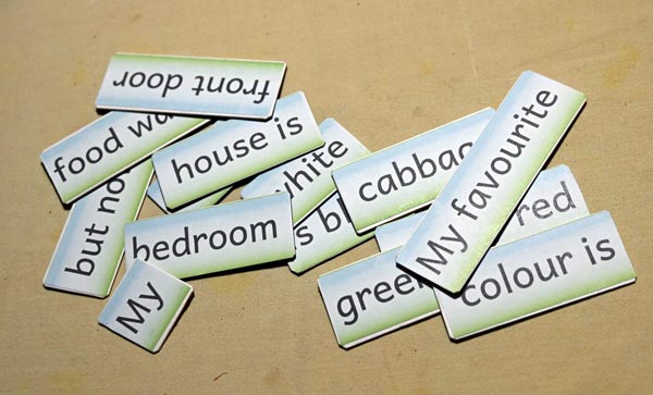 Fifteen Word Cards in a jumbled pile spread out on a table
